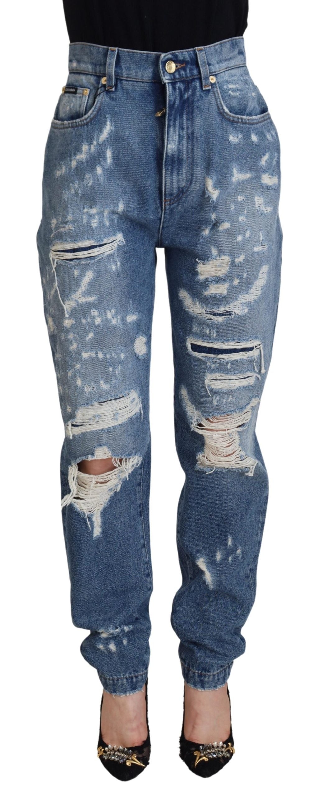 Blå tvättade bomulls-trasiga denimjeans