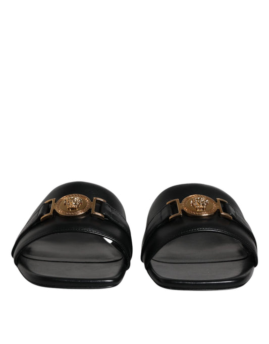 Versace svarte skinnslip-on slip-on-sko med logoplakett