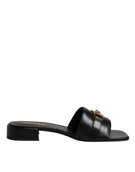Versace svarte skinnslip-on slip-on-sko med logoplakett