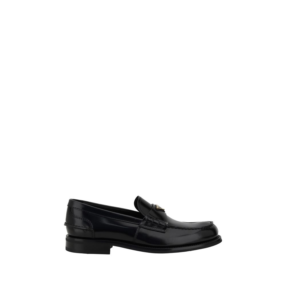 Triangulära loafers med plakett