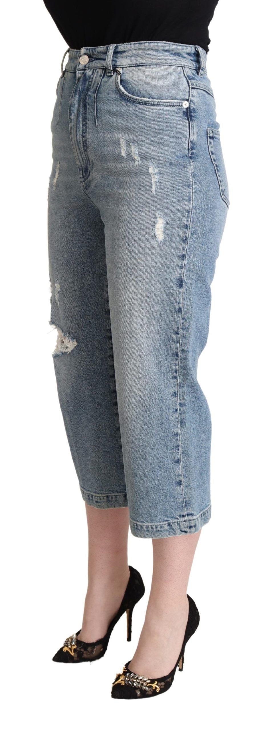 Blåa slitna bomullsdenim Capri-jeans