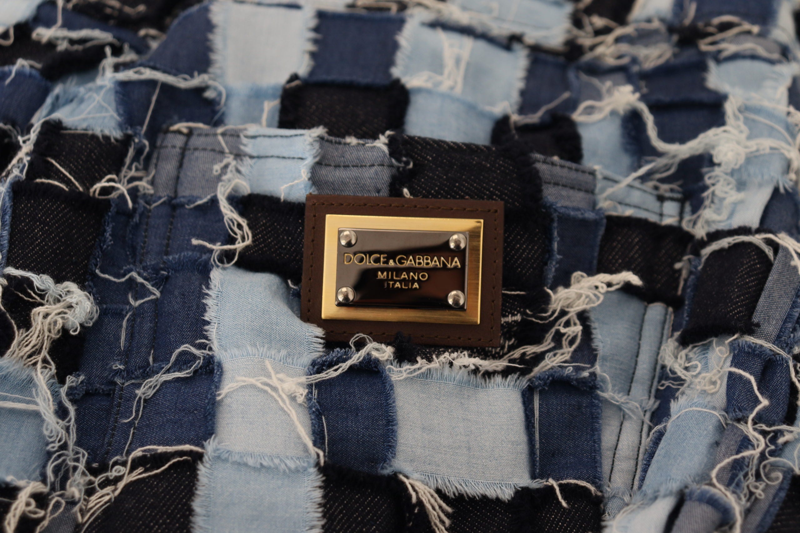 Flerfärgade lapptäcksmönster i bomull med denim