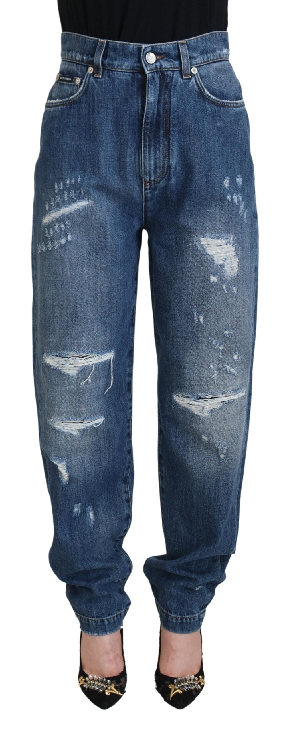 Blå tvättade bomulls-trasiga denimjeans