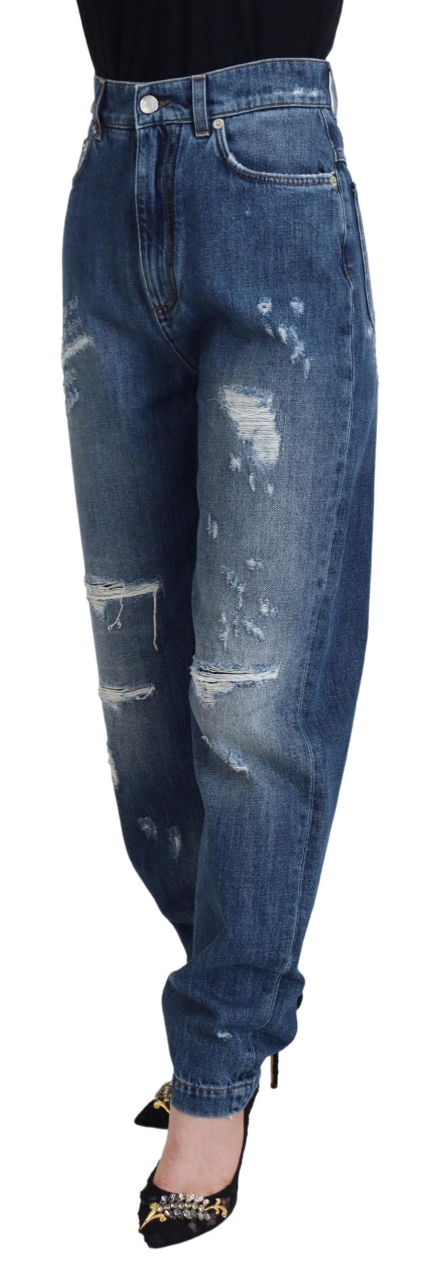 Blå tvättade bomulls-trasiga denimjeans