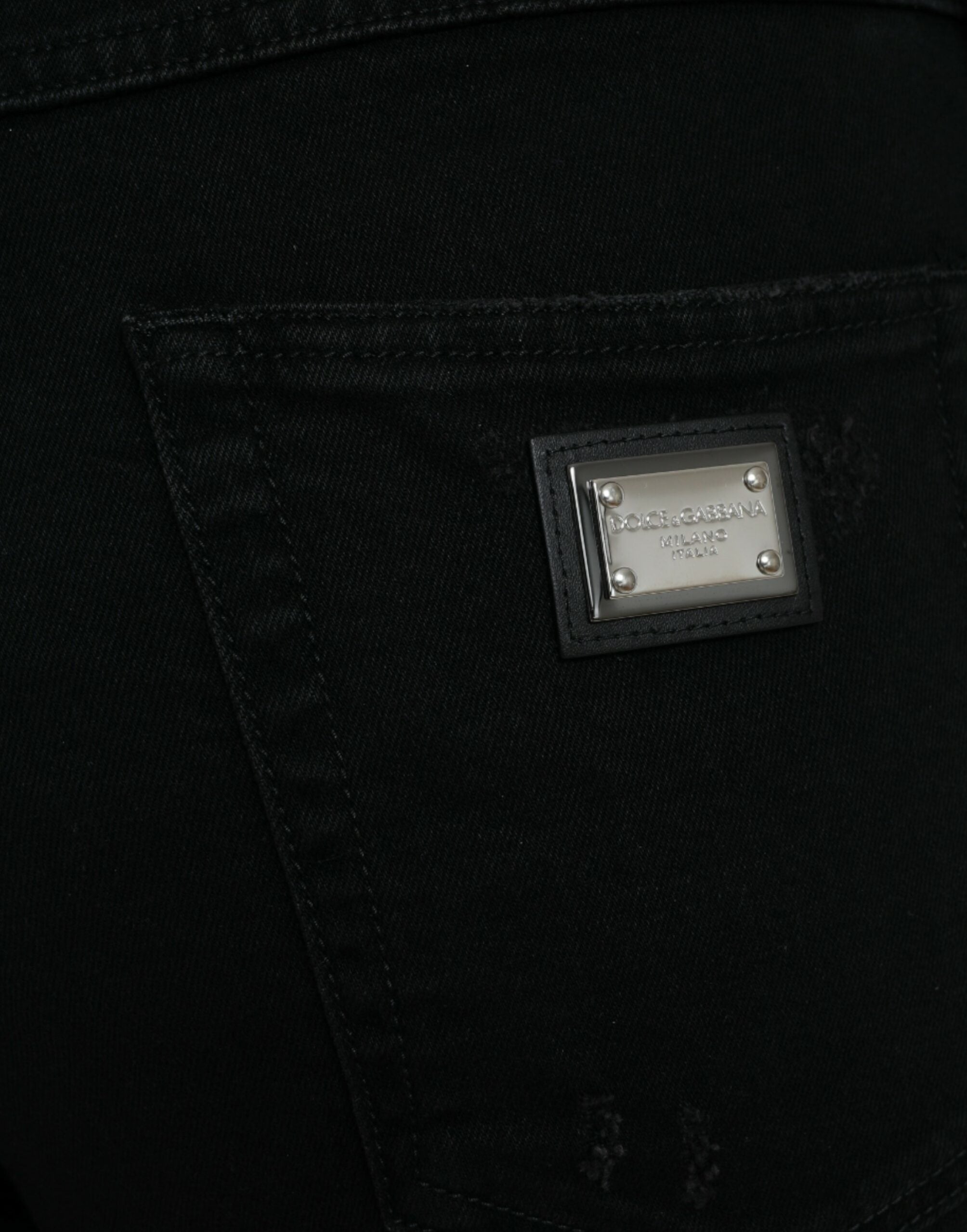 Svarta bomullsjeans med hög midja och slitna denim
