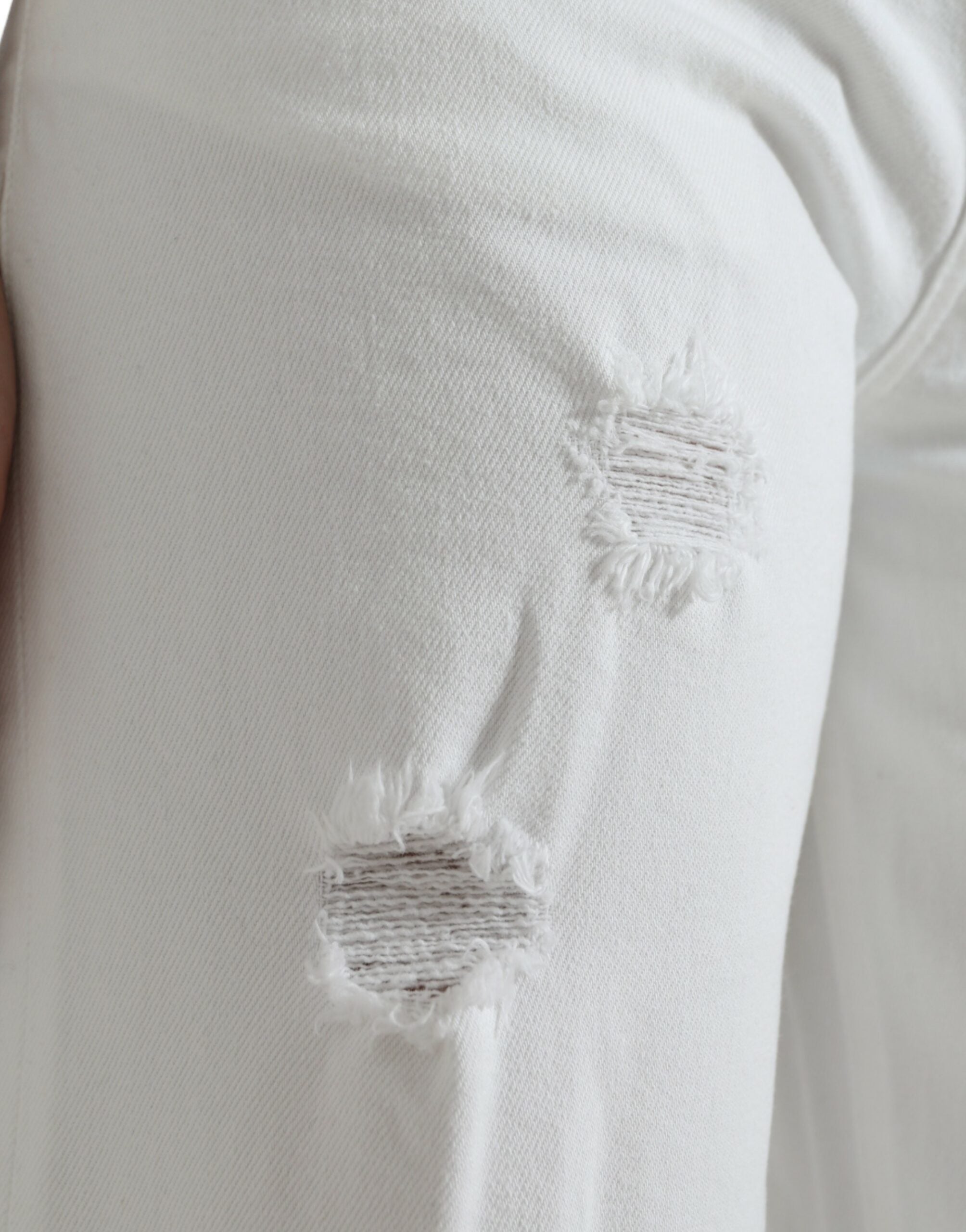 Vita bomullsbeskurna jeans med vida ben