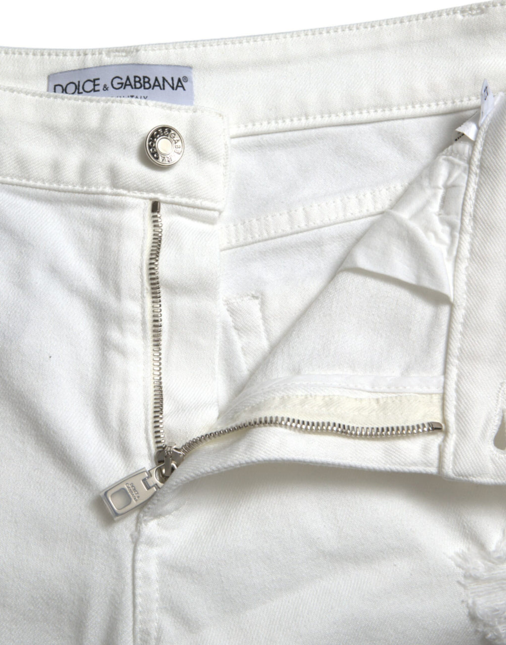 Vita bomullsbeskurna jeans med vida ben