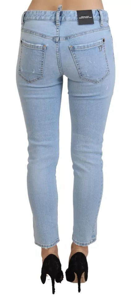 Blåa slitna, korta Twiggy-jeans med medelhög midja