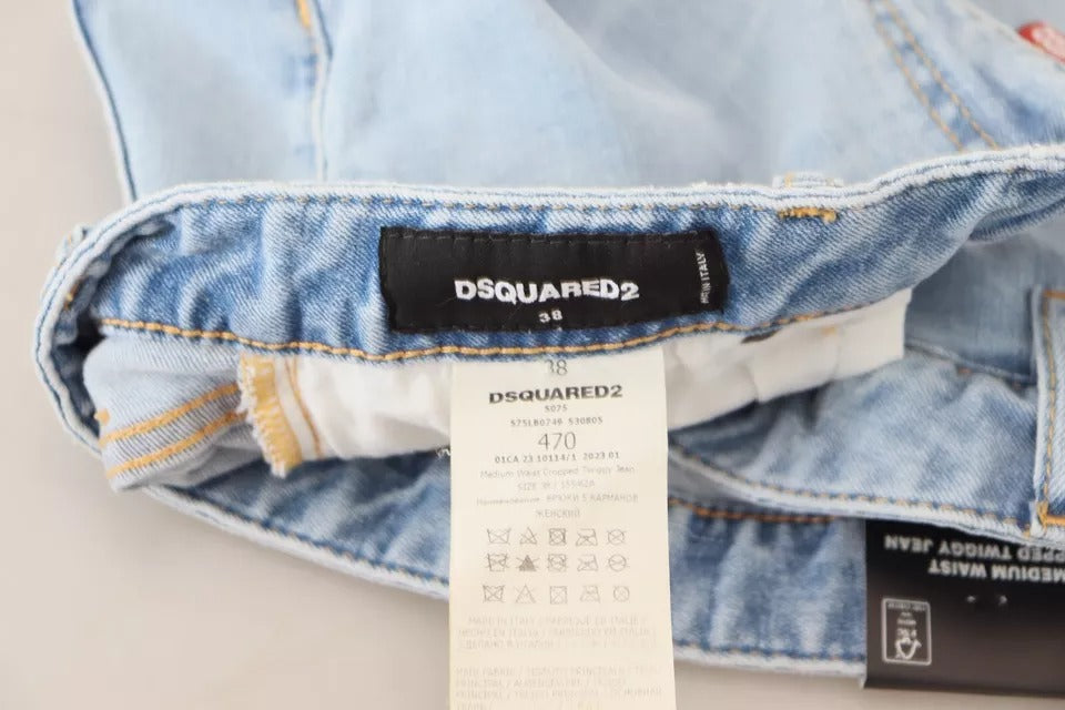 Blåa slitna, korta Twiggy-jeans med medelhög midja