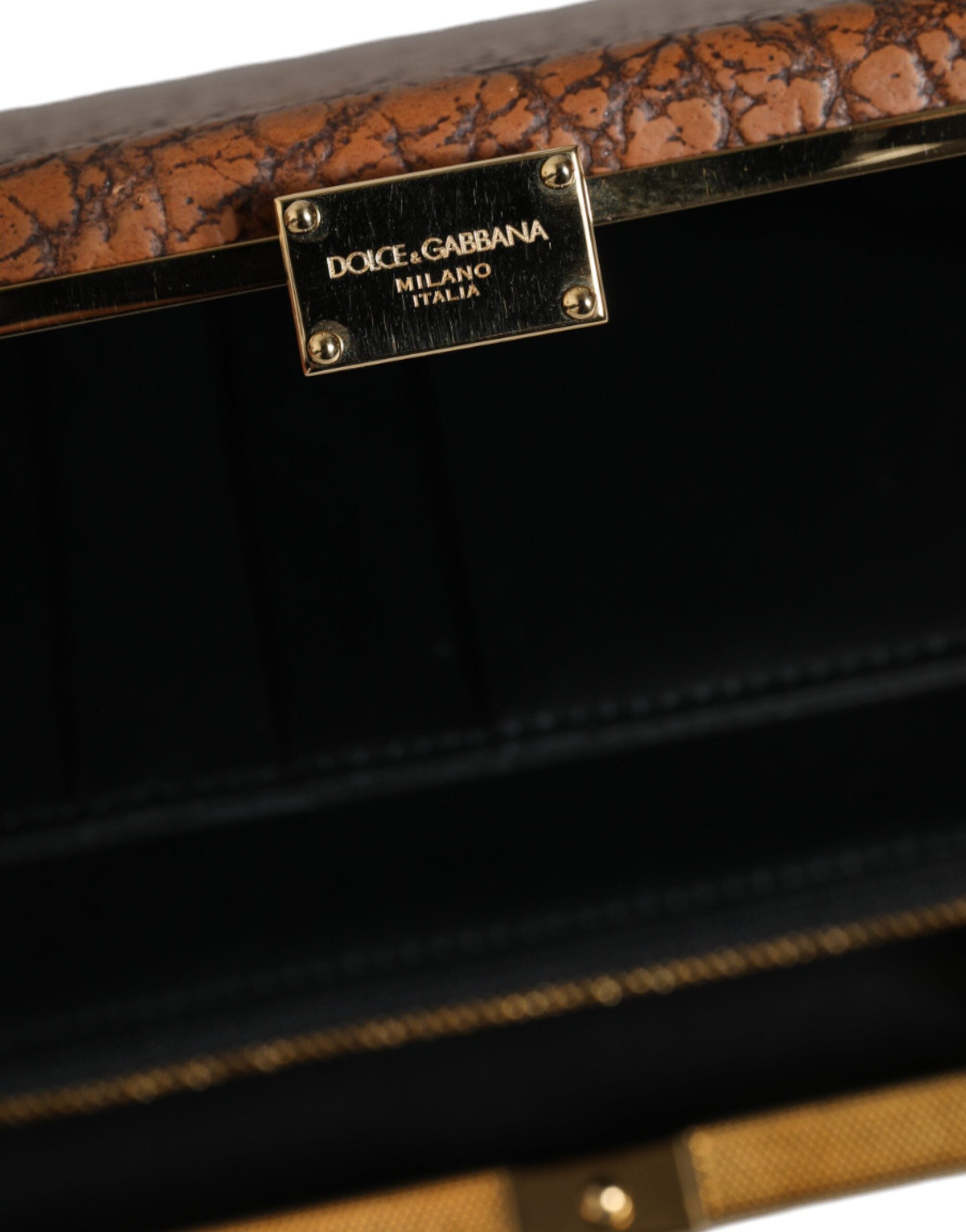 Brun clutch-mini-skulderveske i skinn med gullramme