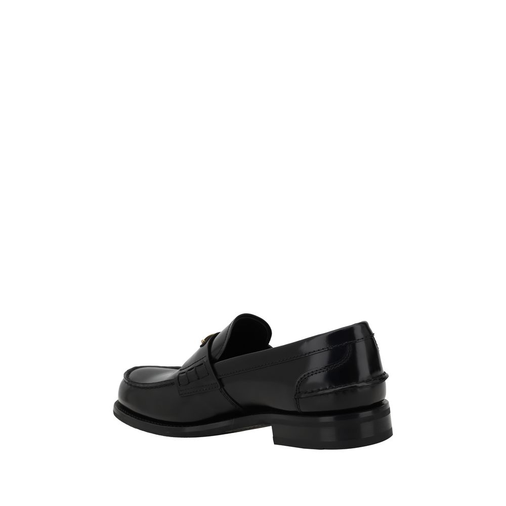 Triangulära loafers med plakett