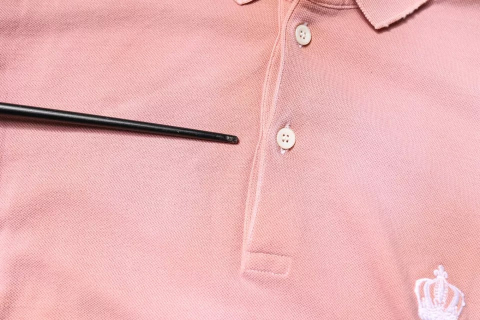 Rosa pikétröja med kort ärm och kronkrage