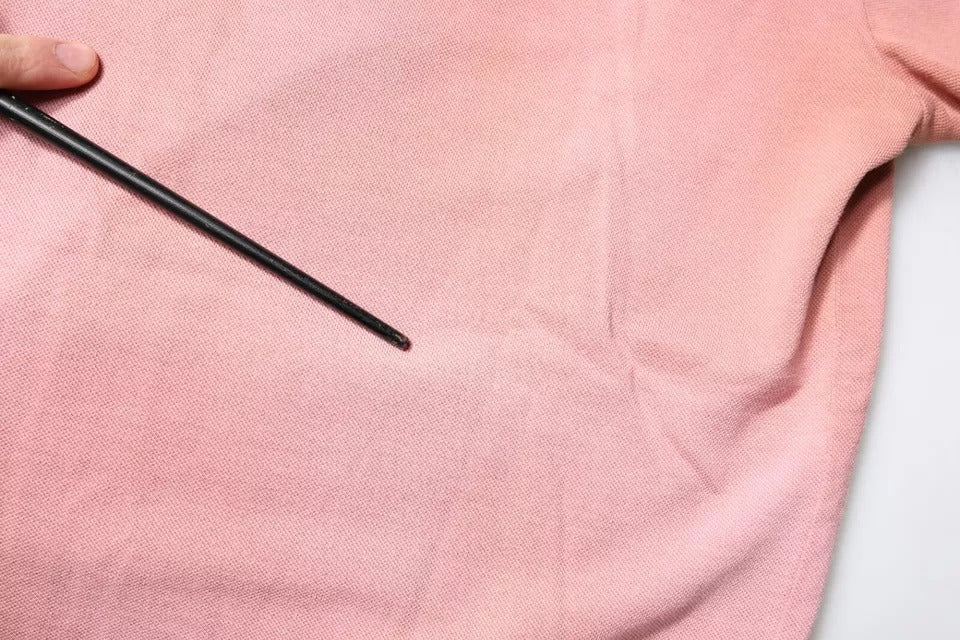 Rosa pikétröja med kort ärm och kronkrage