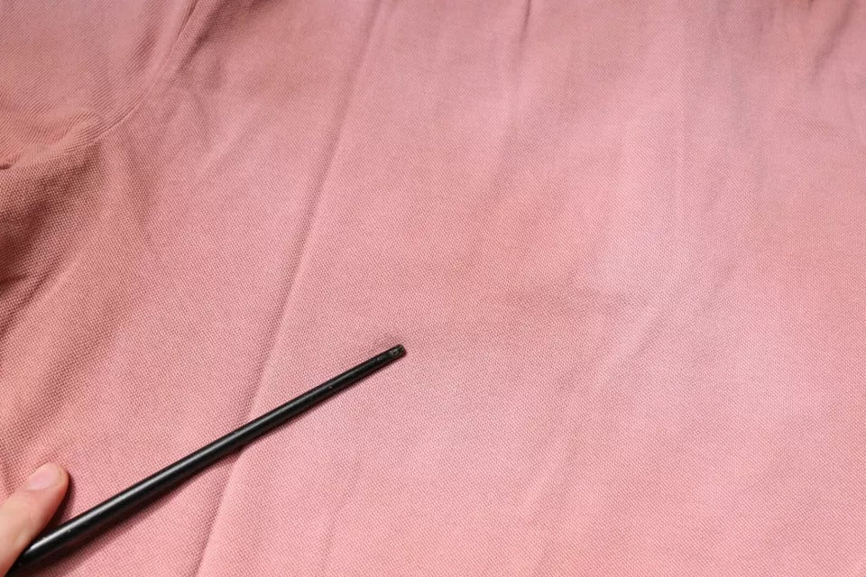 Rosa pikétröja med kort ärm och kronkrage