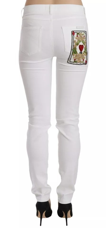 Vita kristallutsmyckade skinny jeans