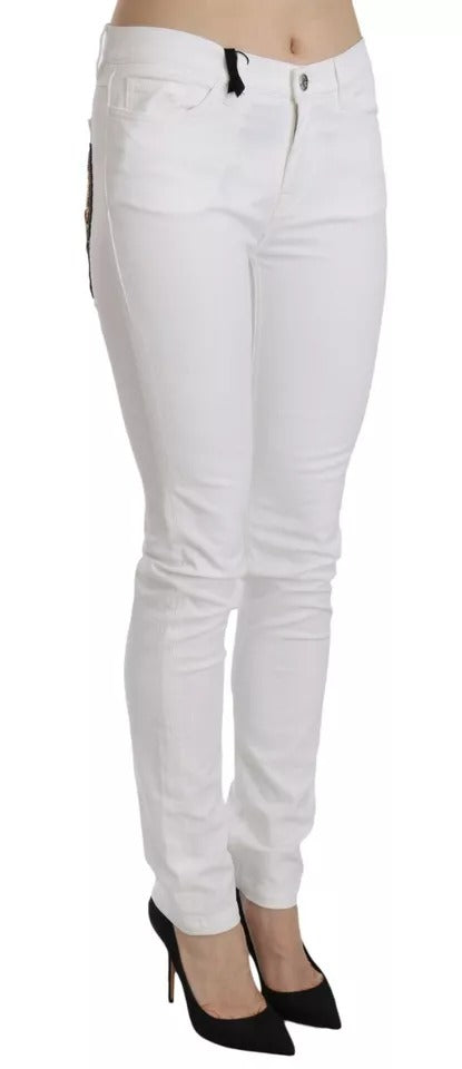 Vita kristallutsmyckade skinny jeans