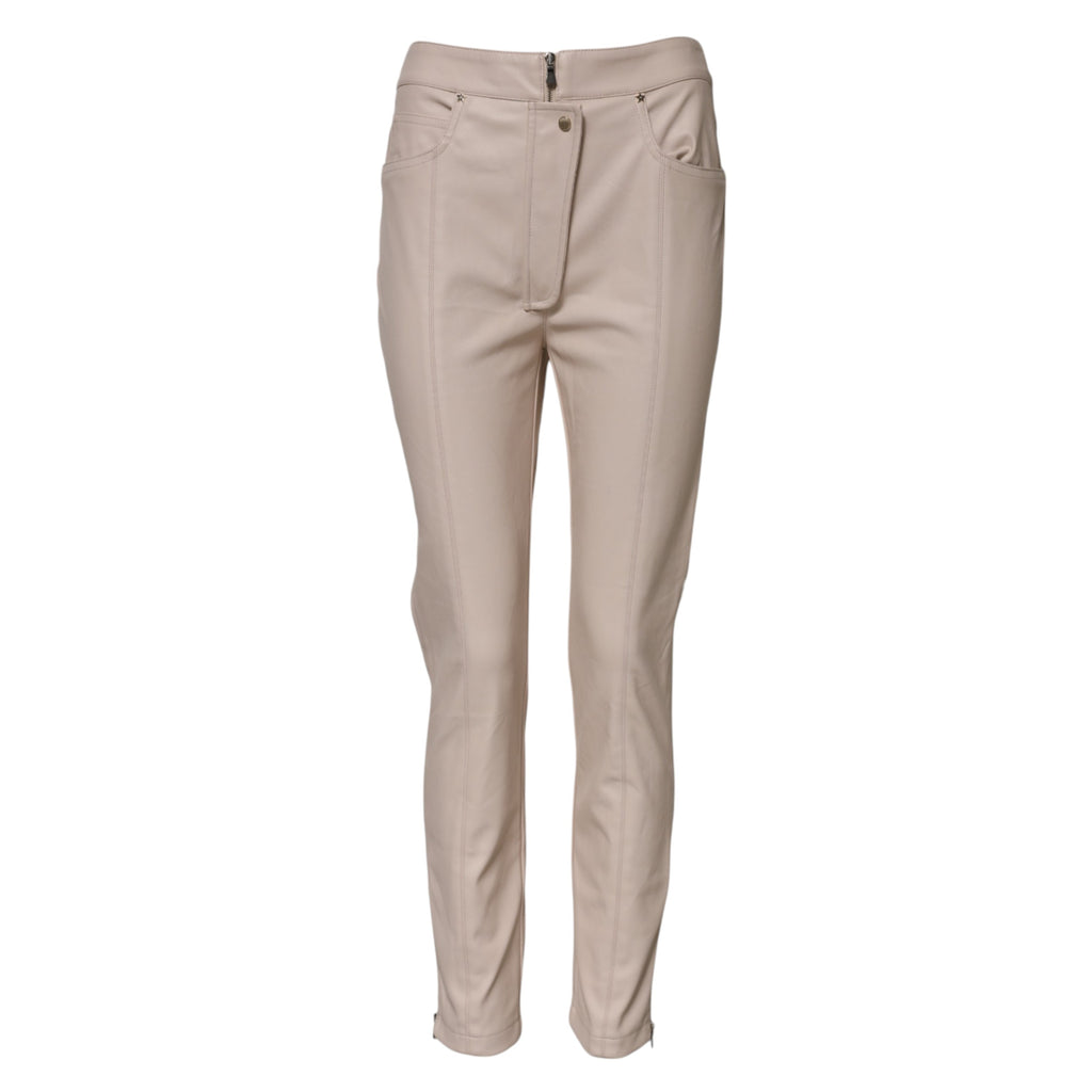 Beige høylivede, avsmalnende bukser 