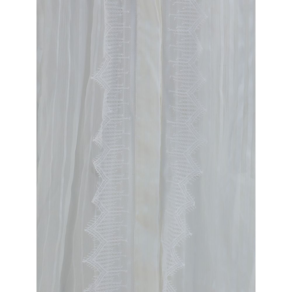 Blus i sidenmuslin och spets med volang