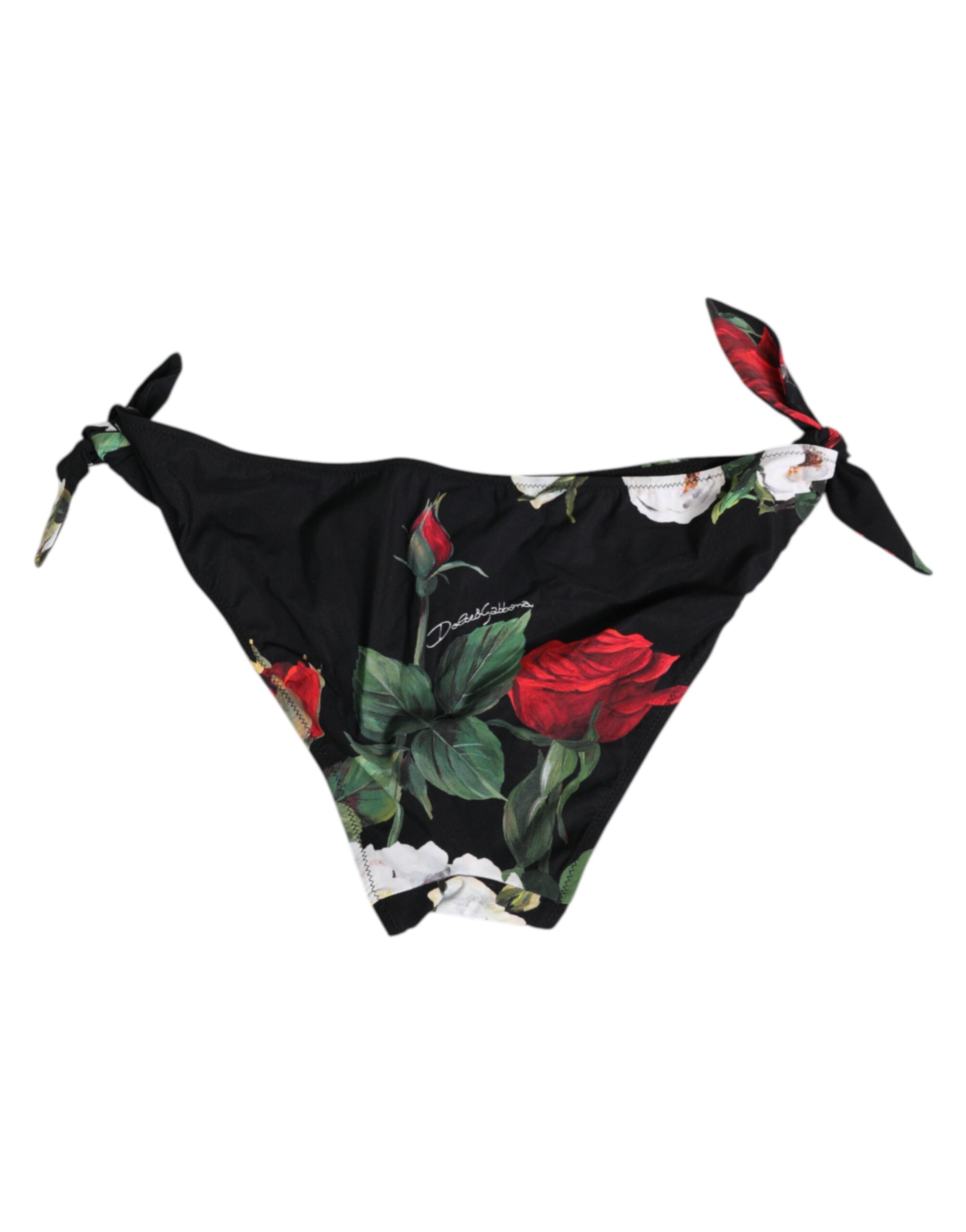 Svart bikiniunderdel med blommigt knytband i sidan och badkläder